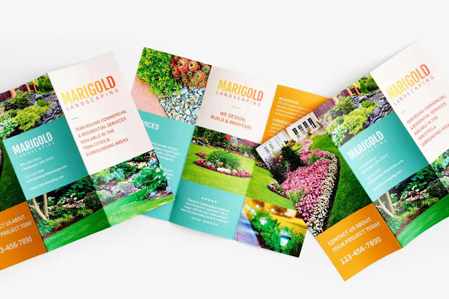 Three lawn care marketing brochures overlapping each other and printed with Marigold Landscaping and images of flowers.