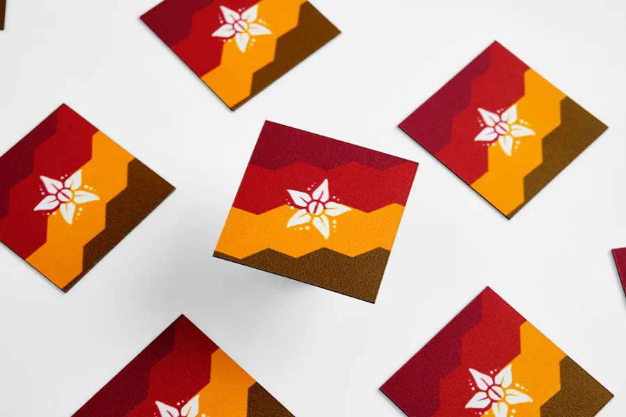 Six scattered custom magnets with a red, orange and brown design.