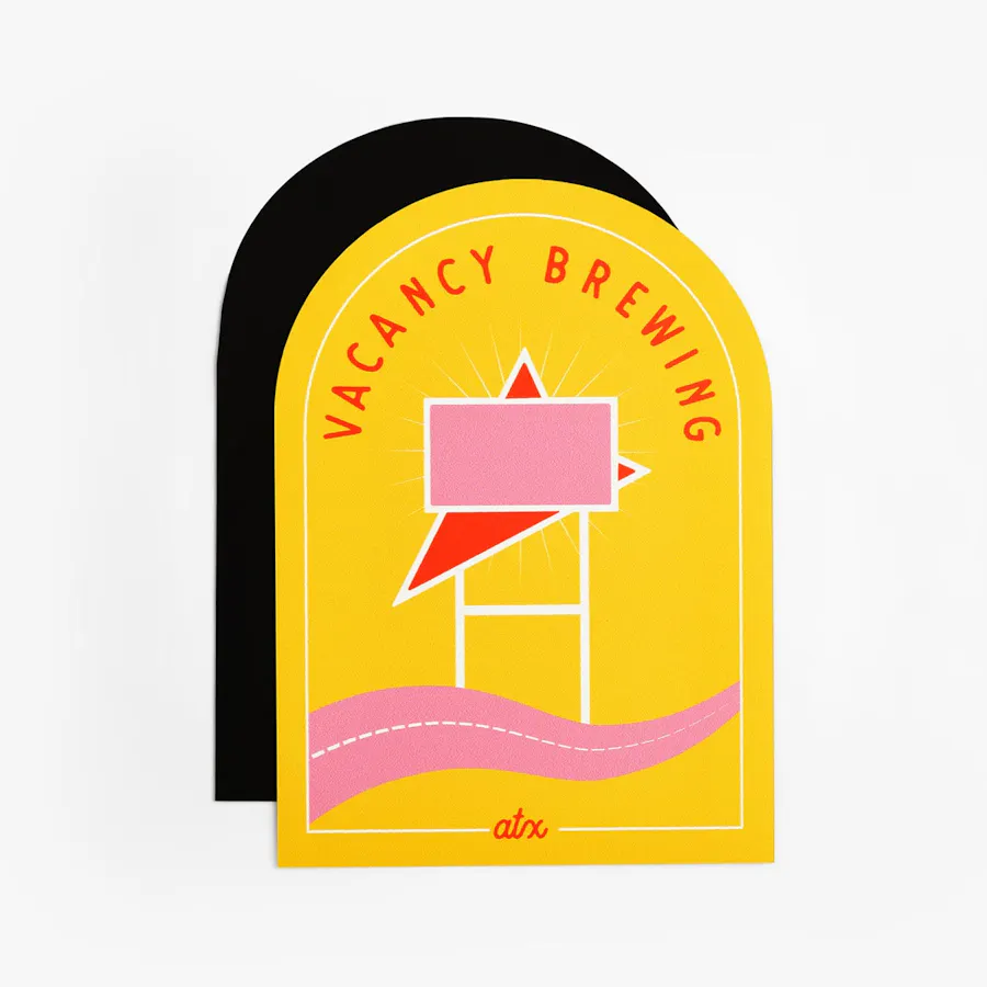 A car magnet in a custom shape with a yellow, pink and red design and Vacancy Brewing.