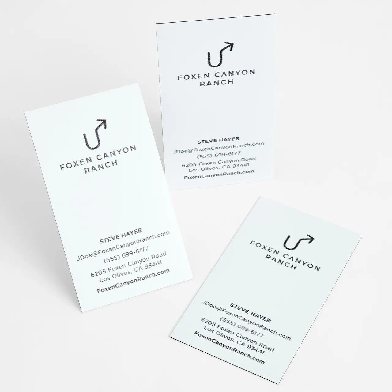 Three business card magnets spread out with a white background and Foxen Canyon Ranch in black.