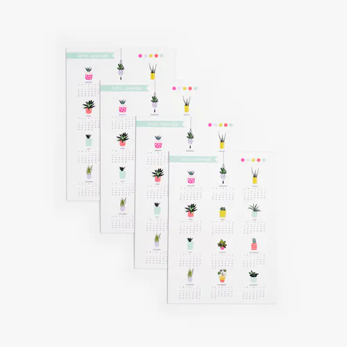 Four magnetic calendars fanned out with a white background and succulent designs above each month.