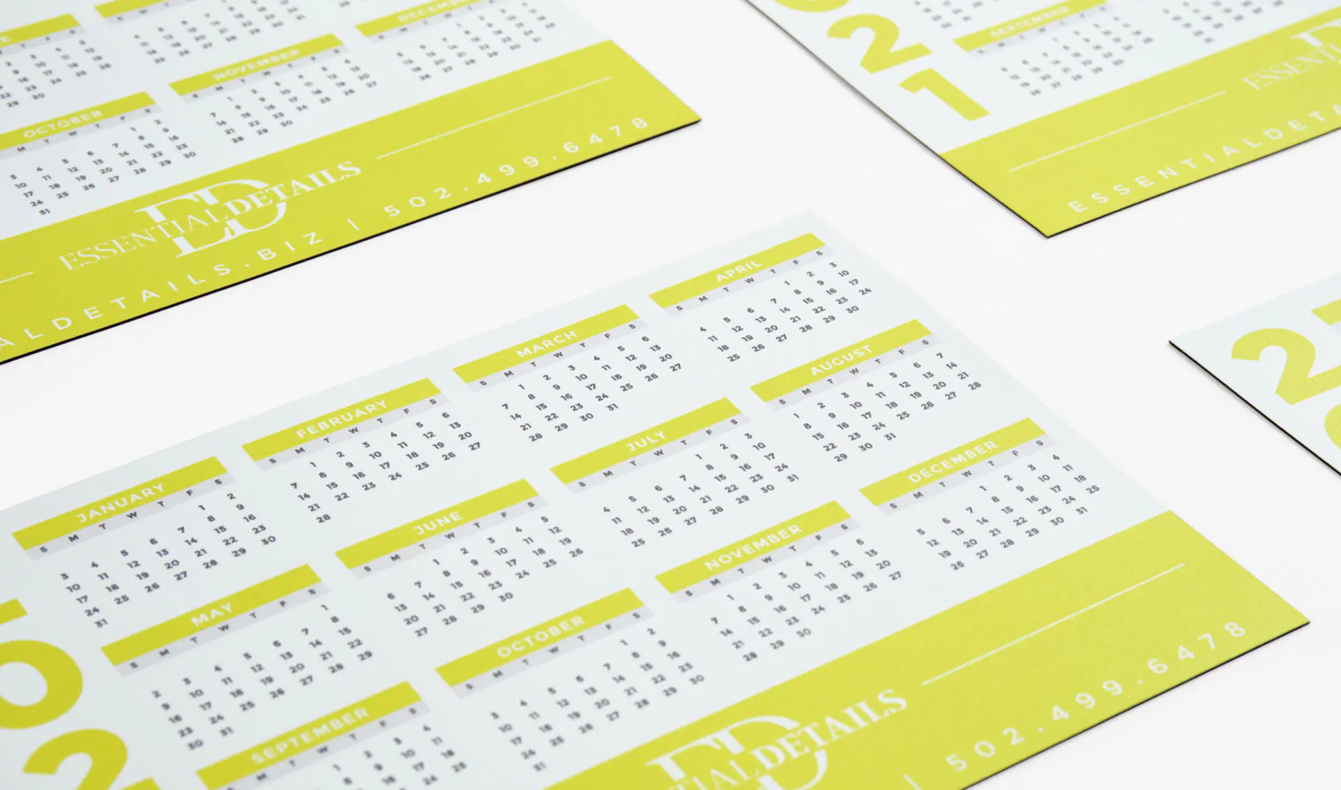 2021 calendar magnets lined up in rows and printed with a lime green design and the months of the year in black.