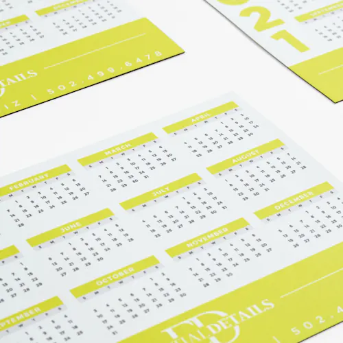 2021 calendar magnets lined up in rows and printed with a lime green design and the months of the year in black.