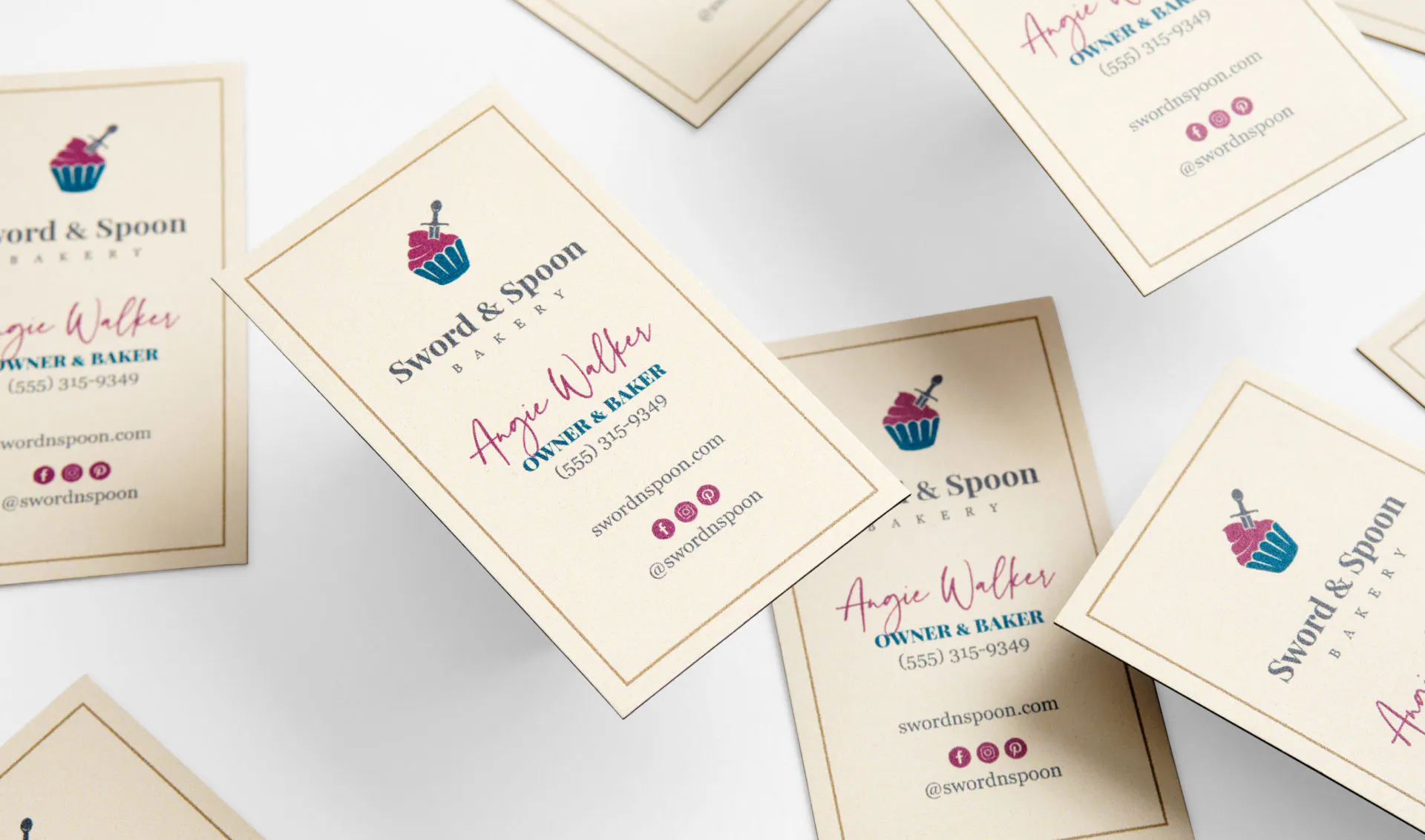 Five magnet business cards scattered and printed with a vertical orientation and Sword & Spoon Bakery in black.