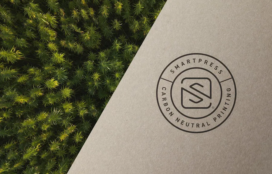 The Smartpress Carbon Neutral Printing logo next to pine seedlings viewed from above.