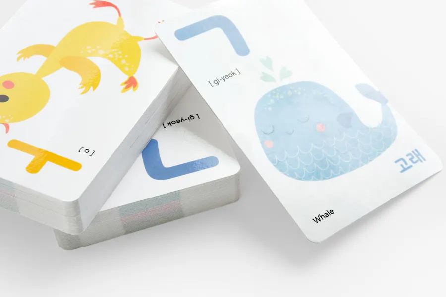A stack of custom language flashcards with Korean letters and animals on each one.