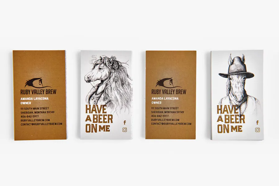 Four unique business cards lined up in a row with "Ruby Valley Brew" and "Have a Beer On Me" on them.