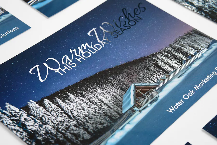 Foil holiday cards with a wintery design on the front and silver foil letters.