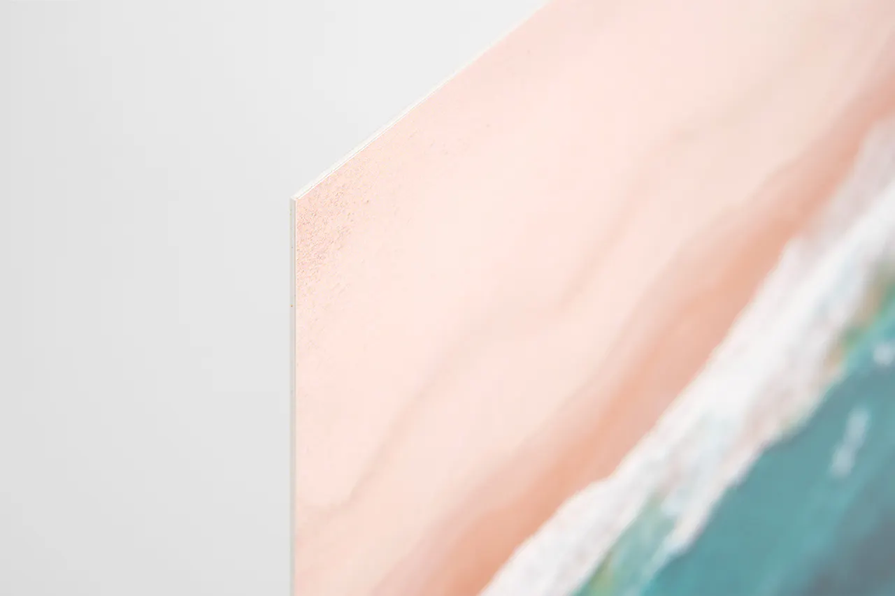 A styGreen sign printed with a sandy beach and ocean design.