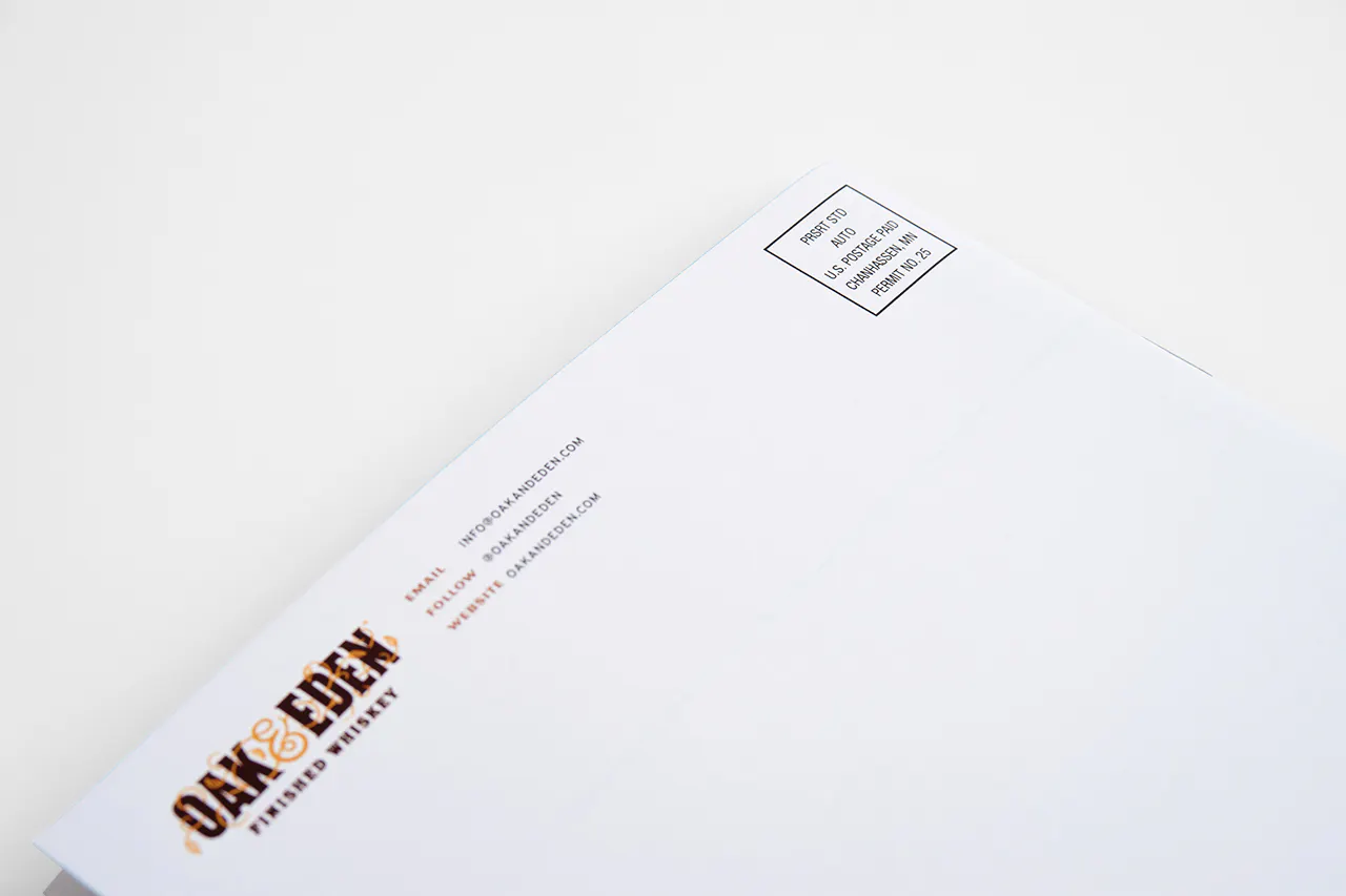 An Oak & Eden direct mail booklet with addressing and postage on a white background.