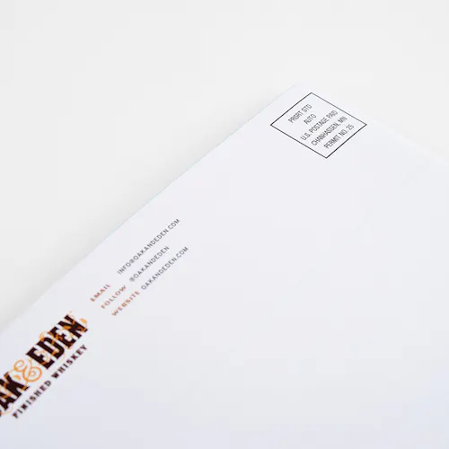 An Oak & Eden direct mail booklet with addressing and postage on a white background.