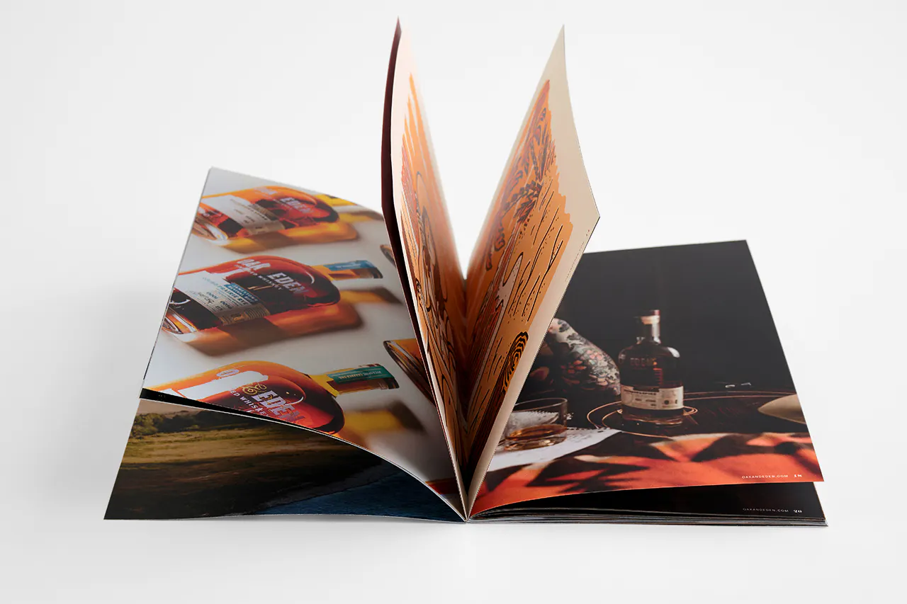 A marketing booklet paying open with pages flipping through images and details of types of whiskey.