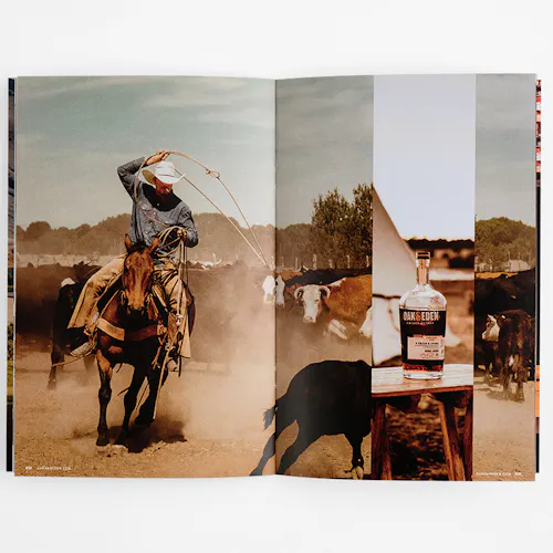 A marketing booklet laying open to images of a man roping cattle and a bottle of whiskey.