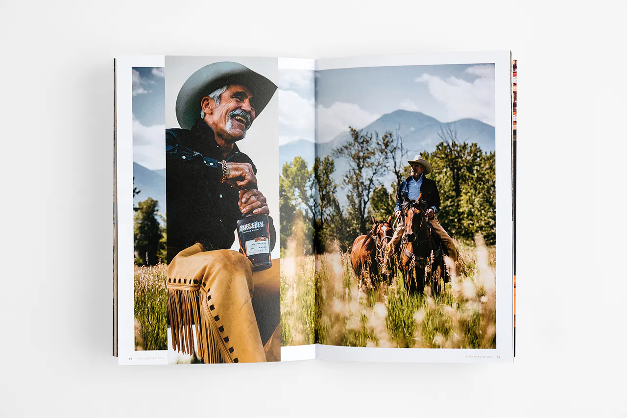 A brand book laying open to images of a man holding a bottle of whiskey and riding a horse.