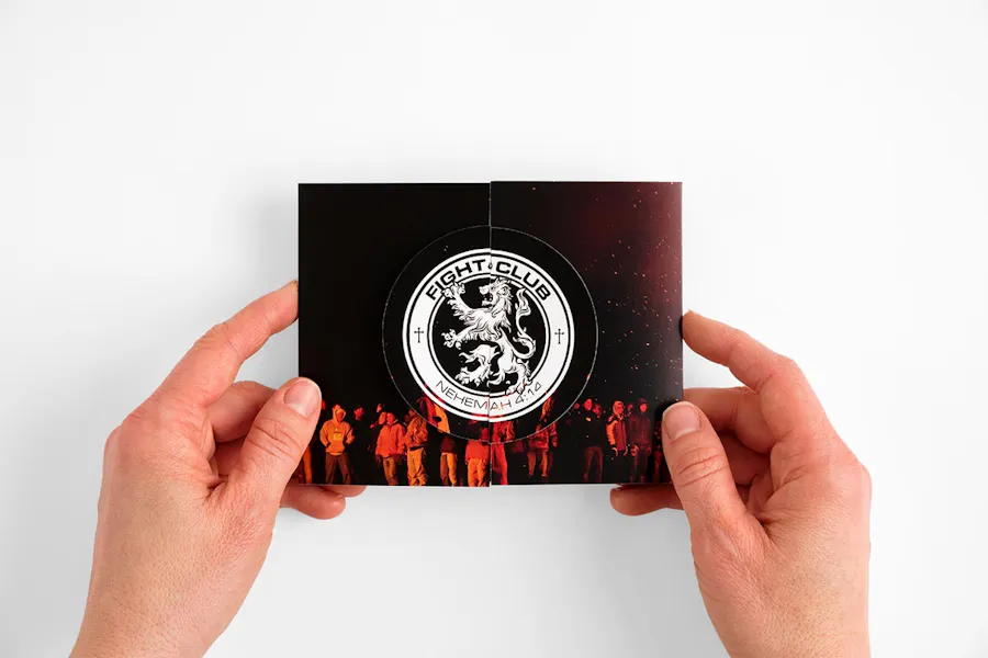 Two hands holding a circle locked gate brochure with Fight Club in the middle.
