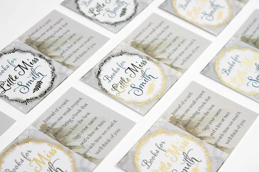 Custom gold foil business cards printed as baby shower invitations with Books for Little Miss Smith in the middle.
