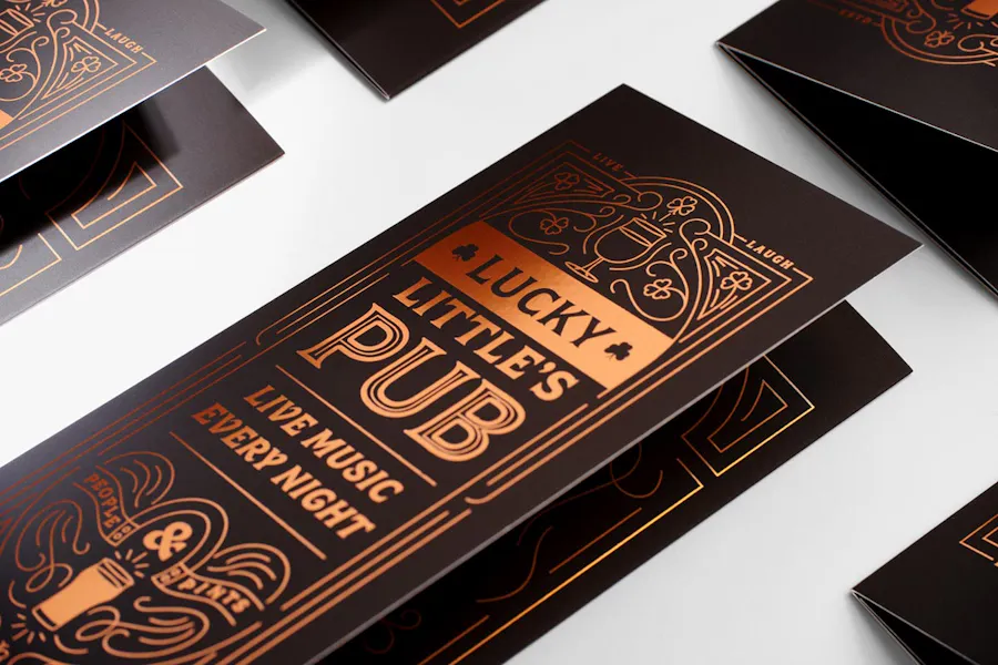 Custom printed foil brochures with rose gold foil and Lucky Little's Pub on the front.