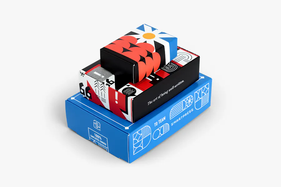 Three product boxes in different sizes stacked on top of each other with blue, white, red and black designs.
