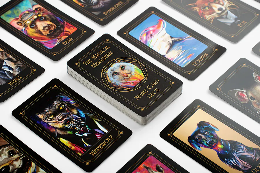 Three rows of Magical Menagerie tarot cards lined up with custom designs of animals in bright colors.