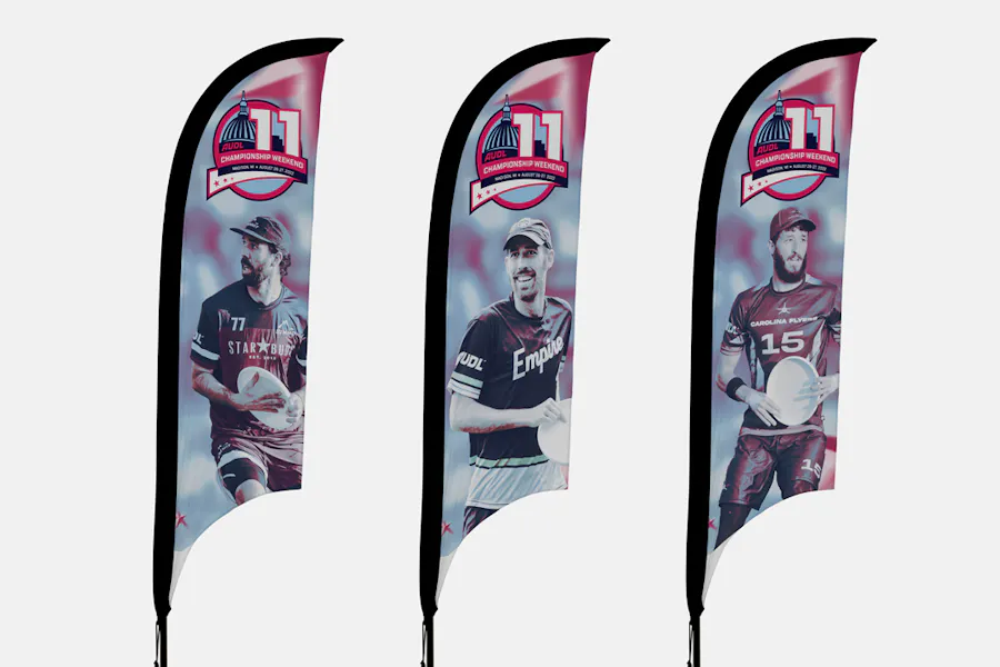 Three razor feather flags lined up in a row printed with an ultimate frisbee player on each one.