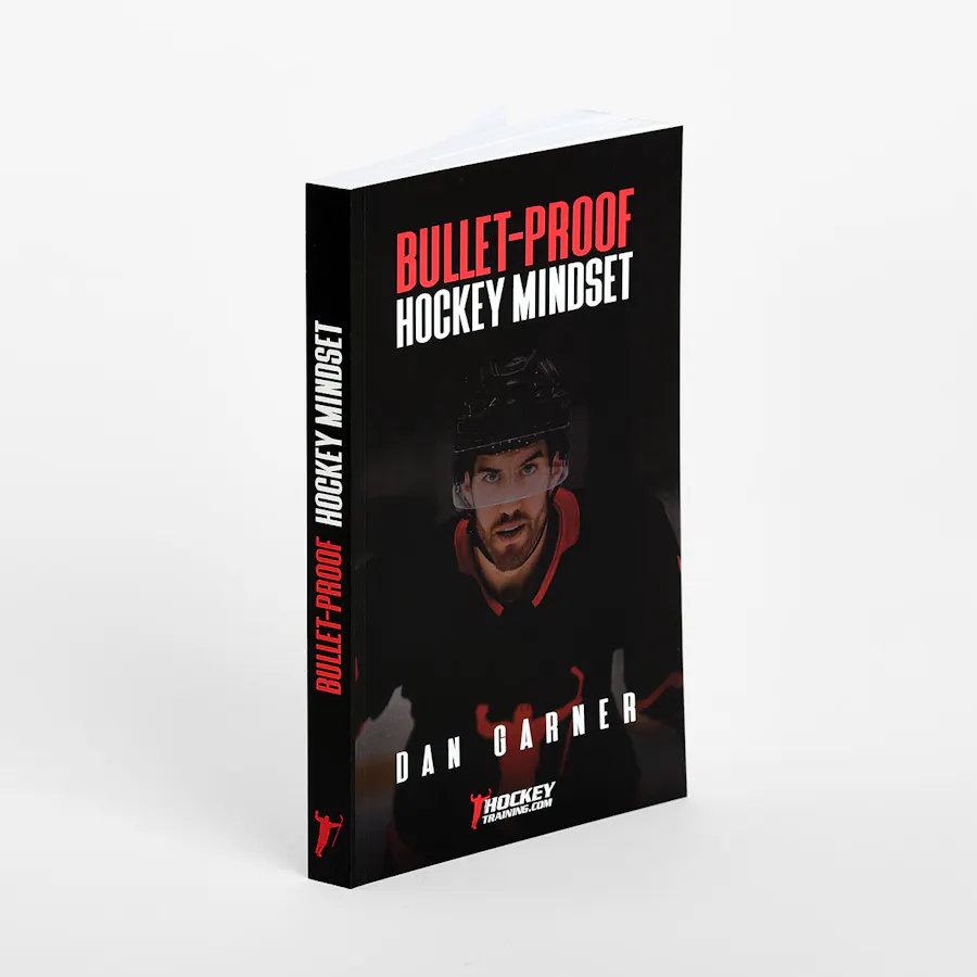 A book with a perfect binding and the title "Bullet-Proof Hockey Mindset" in red and white letters.