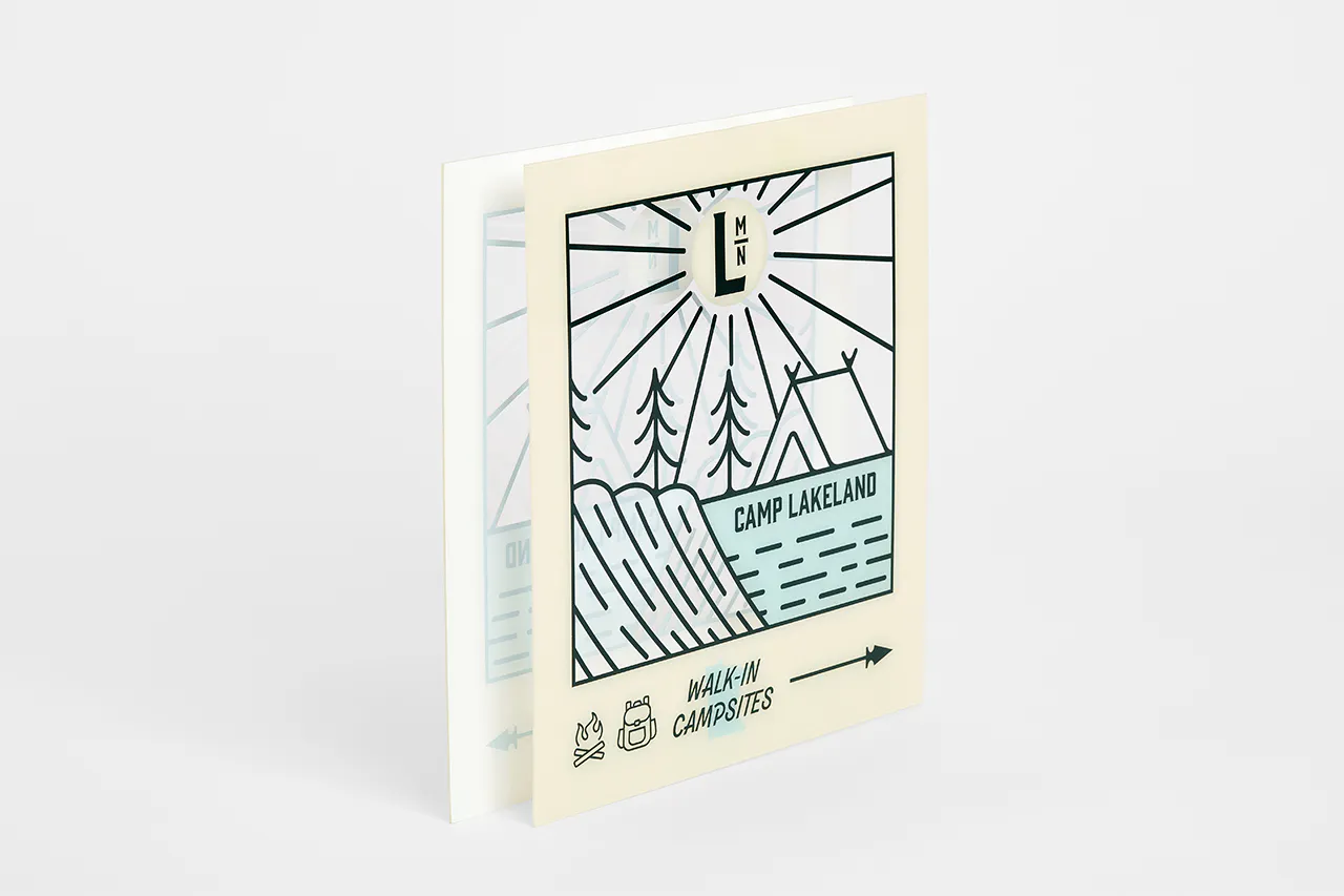 A custom clear sign printed with a camping design and Camp Lakeland.