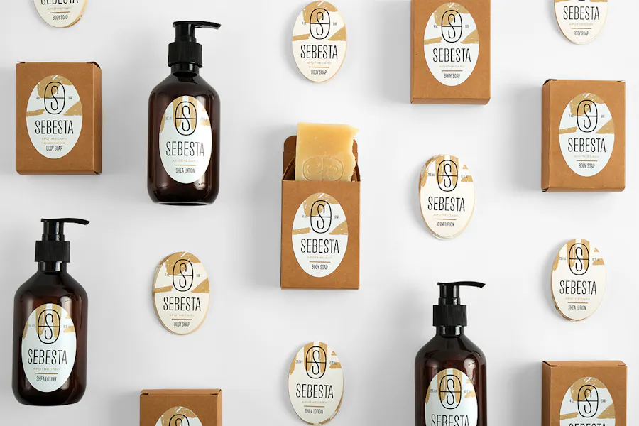 Soap bars and lotion bottles lined up with oval labels printed with Sebesta Apothecary.