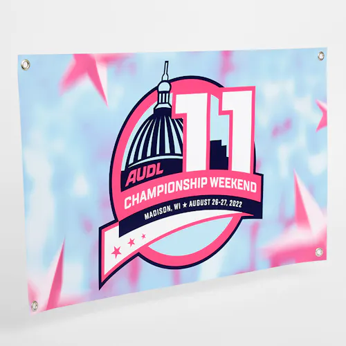 A custom hanging banner with grommets in the corners and printed with AUDL Championship Weekend 11 in blue, pink and white.