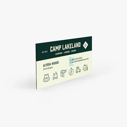 A recycled magnet business card printed with Camp Lakeland and contact info on the front.