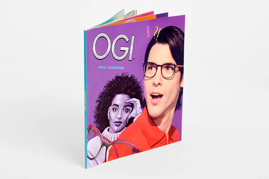 A custom lookbook printed with OGI 2022 Lookbook and a man and woman wearing eyeglasses on the cover.