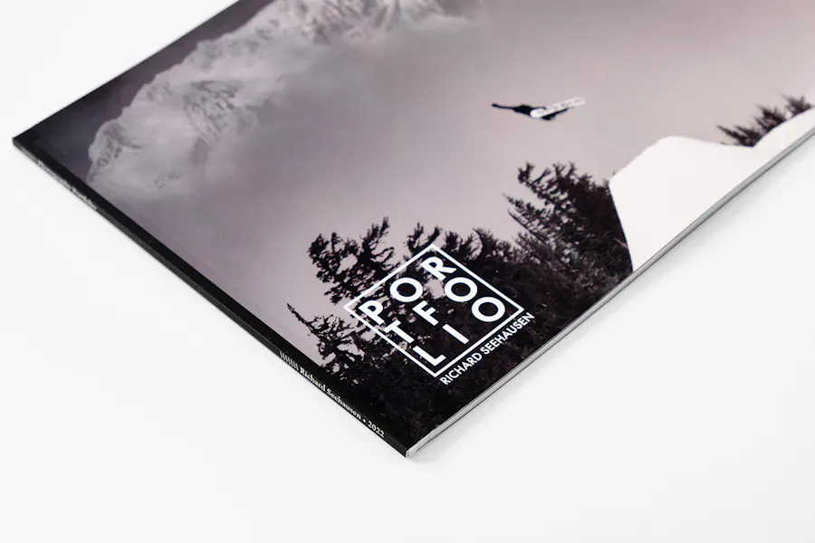 A photography portfolio printed with a black and white image of a snowboarder on the cover and Richard Seehausen in white.