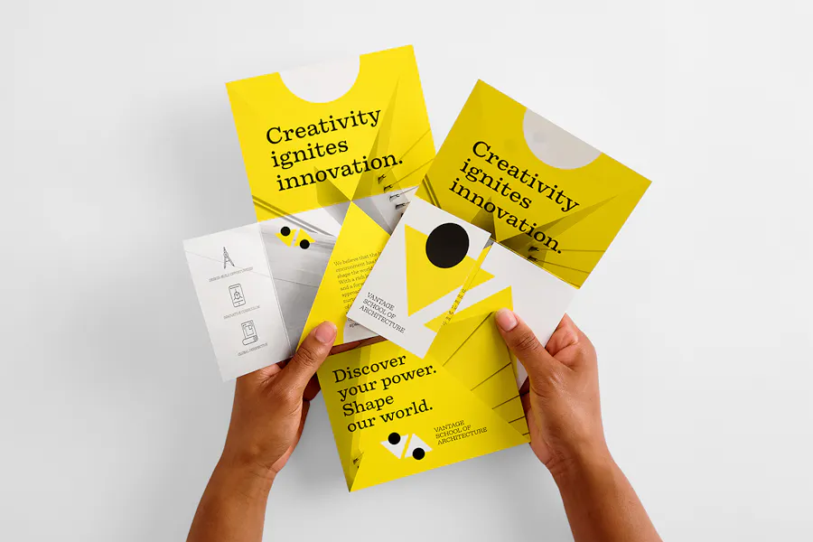 Two hands holding a T-cross direct mailer with a yellow, white and black design.
