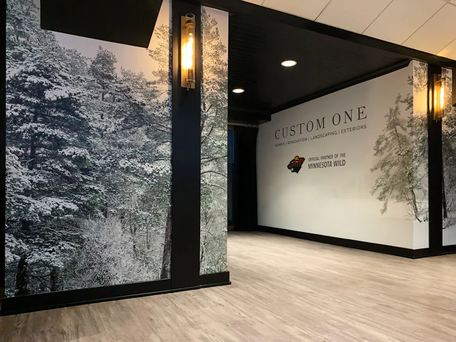 The Custom One Club at the Xcel Energy Center with forest graphics on the walls.