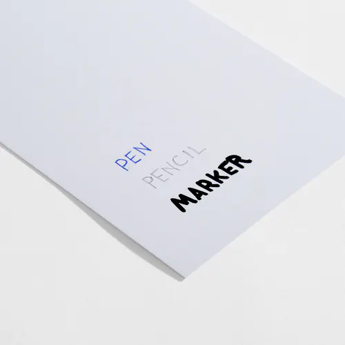 C1S Coated 1-sided semigloss paper stock with pen, pencil and marker written on it.