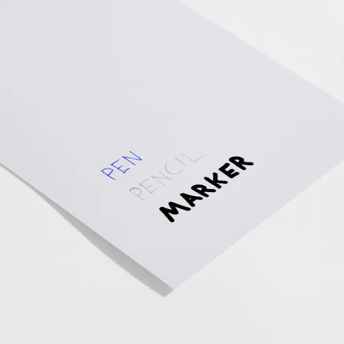 COATED GLOSS Coated gloss paper stock with pen, pencil and marker written on it.