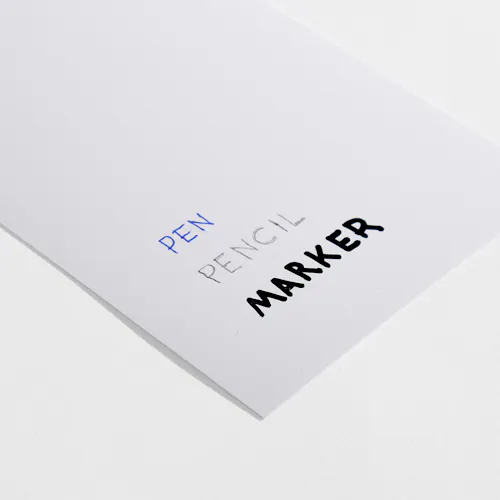 COATED MATTE Coated matte paper stock with pen, pencil and marker written on it.