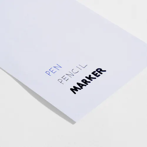 UNCOATED SMOOTH Uncoated smooth paper stock with pen, pencil and marker written on it.