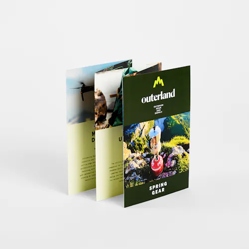 An accordion fold brochure printed with five panels and Outerland Spring Gear on the front.