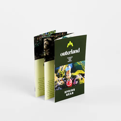 A custom brochure printed with six panels and Outerland Spring Gear on the front.