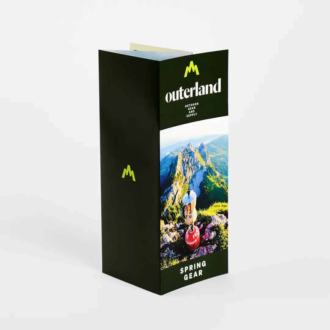 A custom brochure printed with a double parallel fold and Outerland Spring Gear.