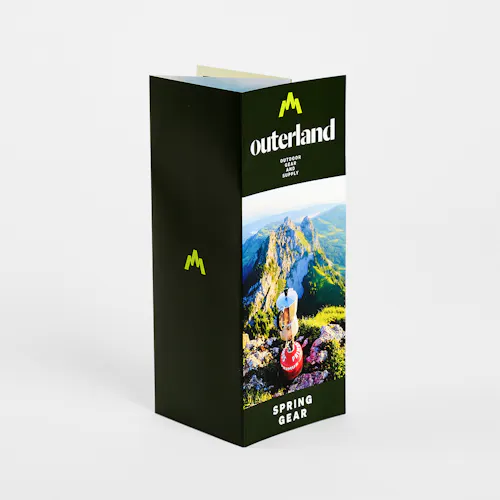 A custom brochure printed with a double parallel fold and Outerland Spring Gear.