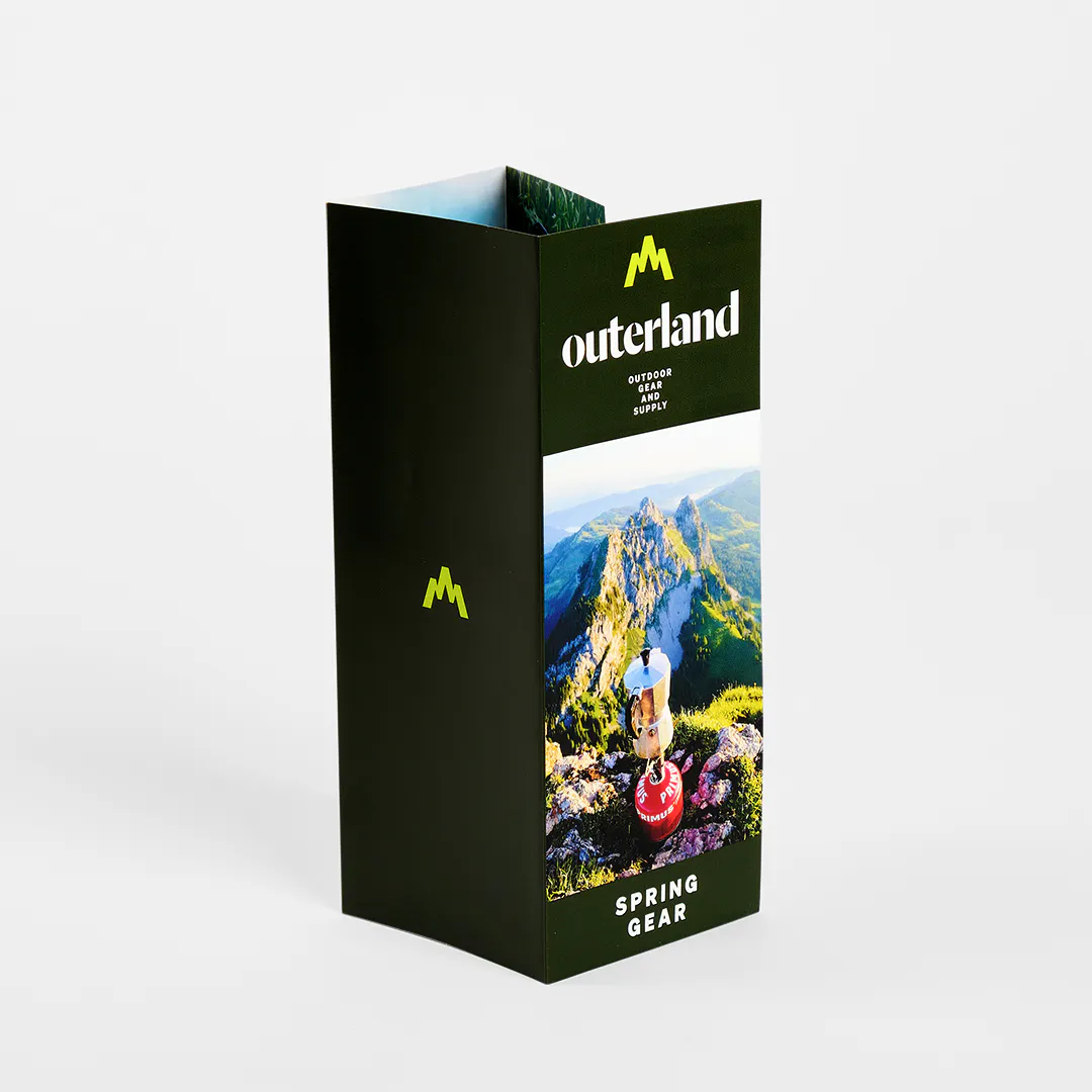 A roll fold brochure printed with four panels and Outerland Spring Gear.