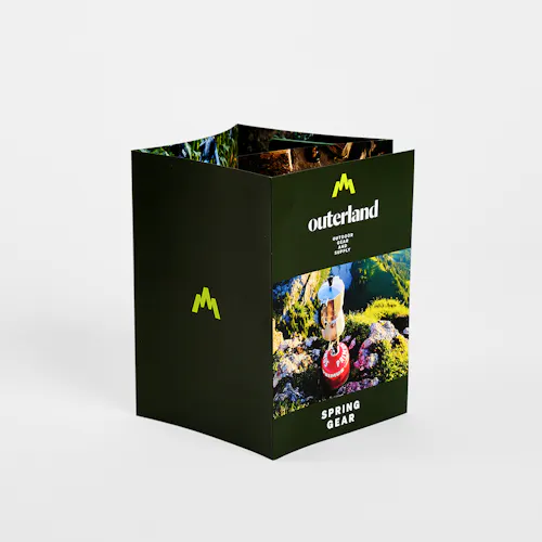 A custom brochure printed with a five-panel roll fold and Outerland Spring Gear.