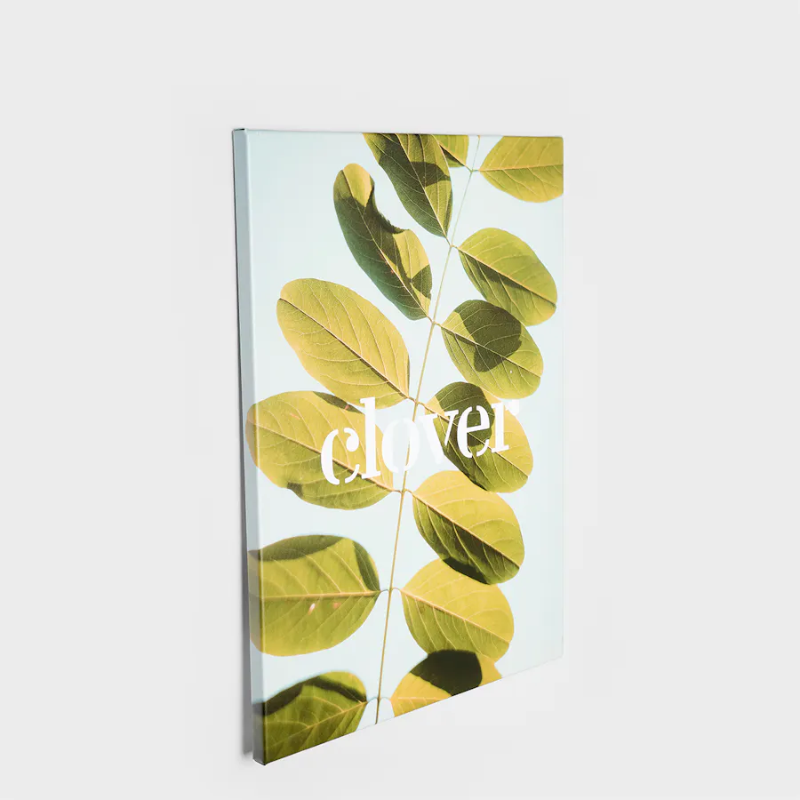 A canvas print printed with a green leave design and Clover in white text.