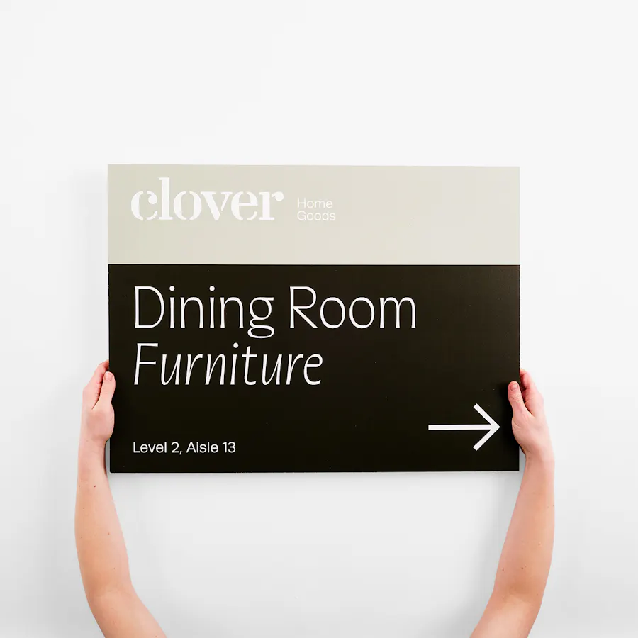 Two hands holding a honeycomb sign printed with Dining Room Furniture and an arrow.