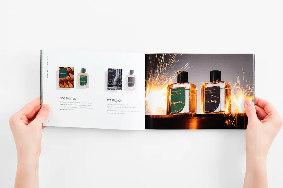 Two hands holding a fragrance brand lookbook to images of four perfume jars and product details.