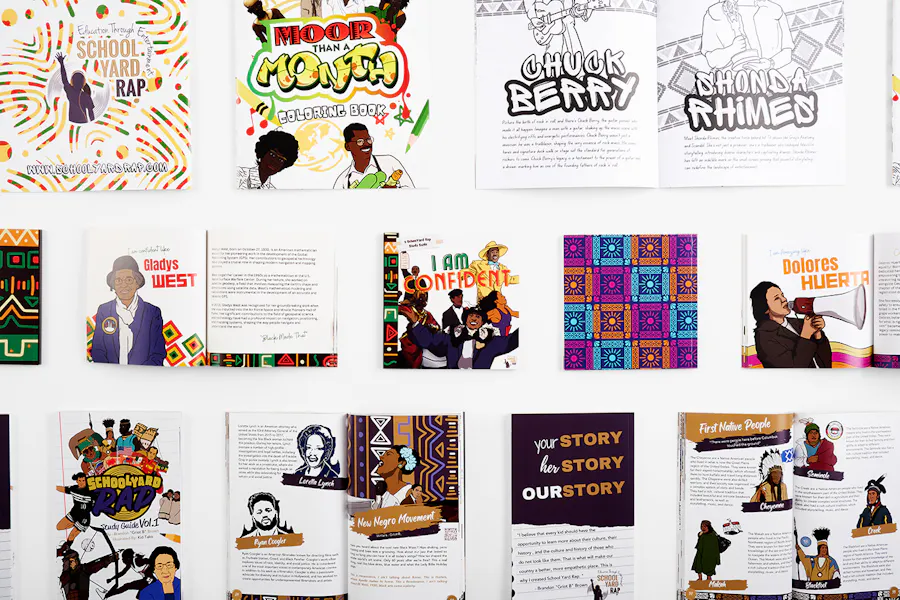 A collection of School Yard Rap educational booklets lined up in rows and printed with vibrant illustrations.