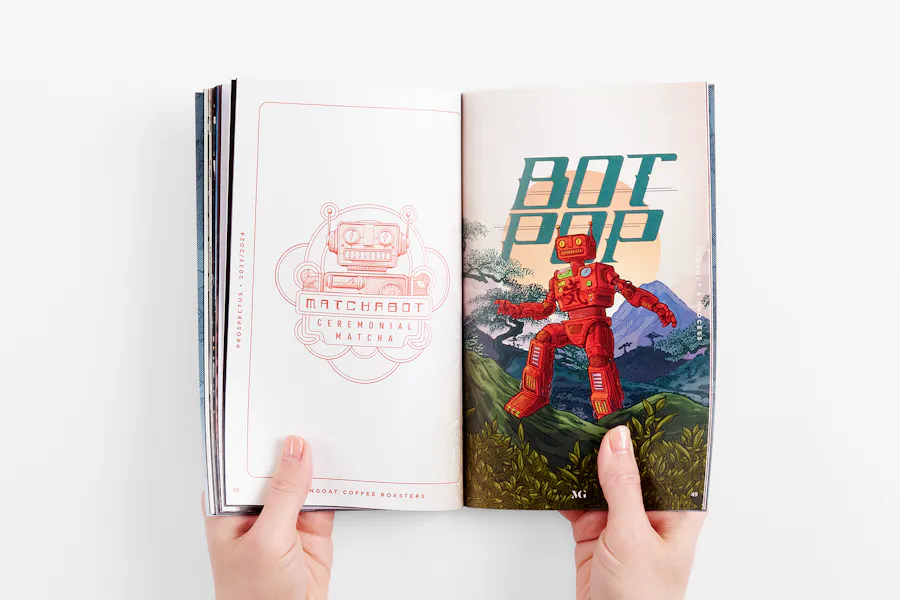 Two hands holding open a MoonGoat Coffee business prospectus printed with images of a red robot.