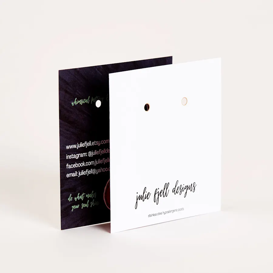 Two jewelry backer cards overlapping each other and printed with a black and white design.