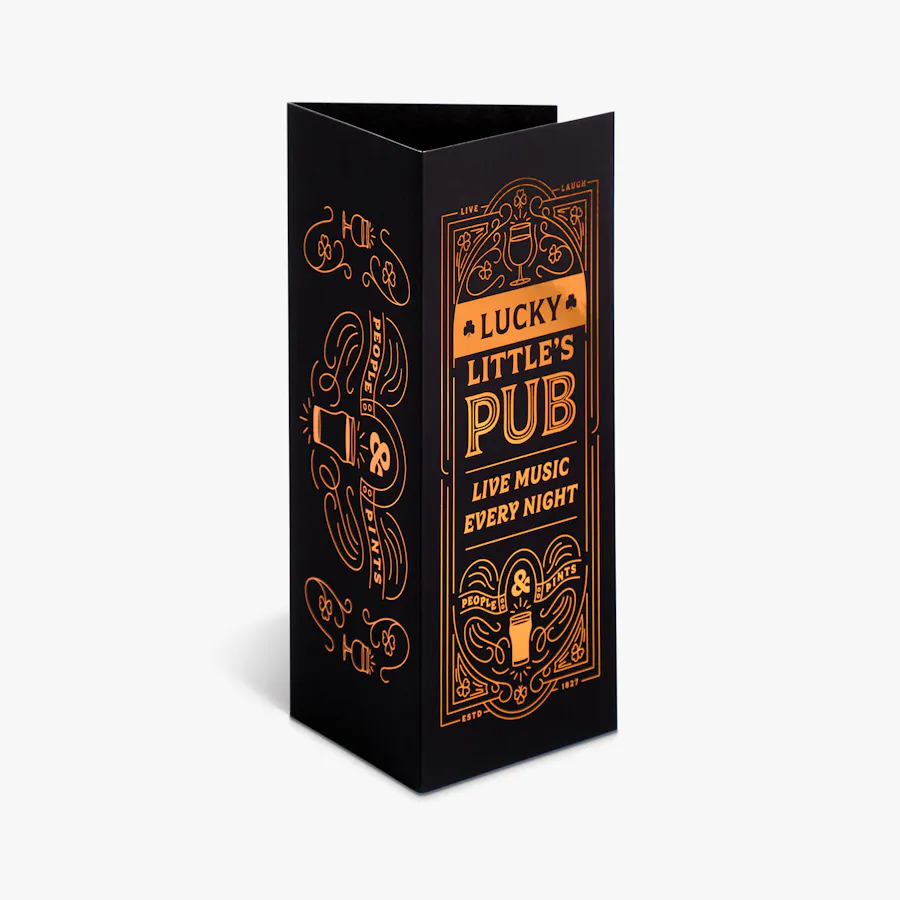 A tri-fold brochure standing and printed with a black background and rose gold foil on the front and back.